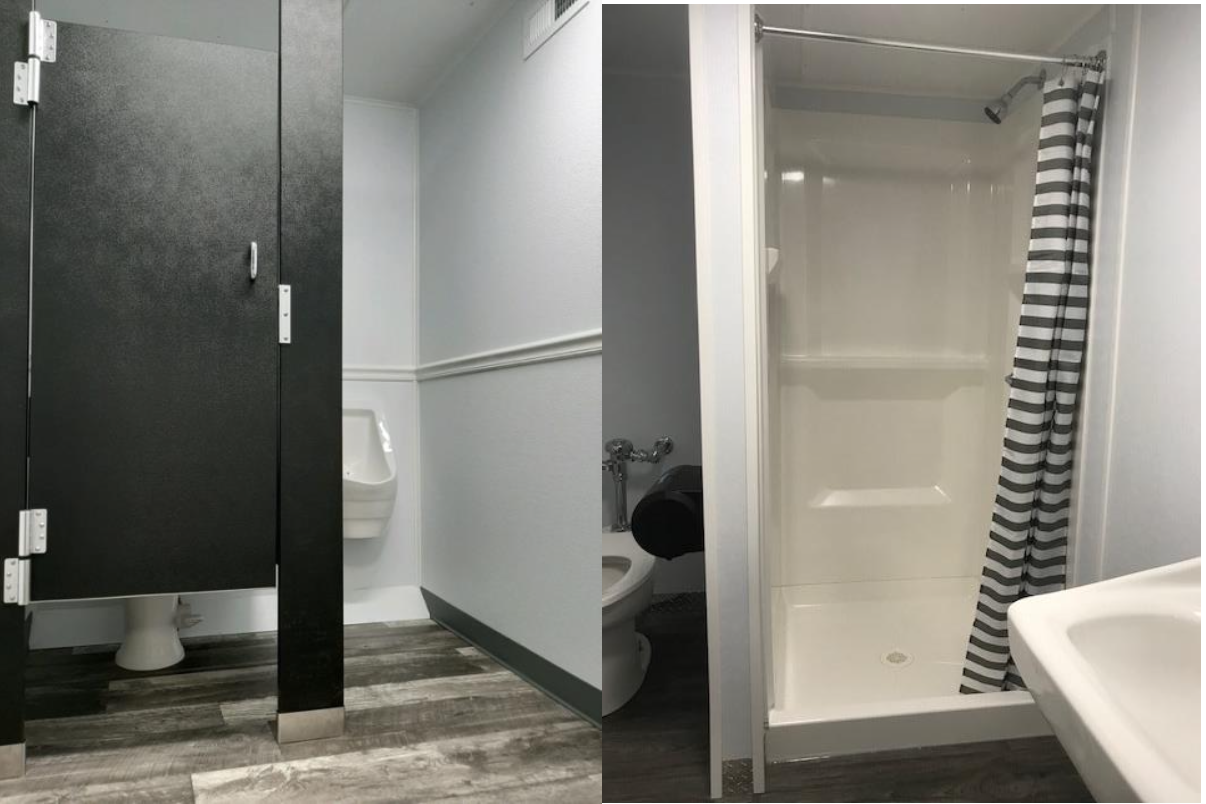 A bathroom with a toilet and a shower.