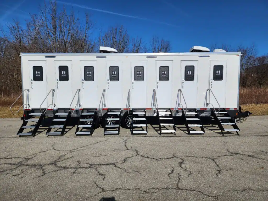 8-Unit Unisex Restroom Trailer with private entrances and steps, ideal for events and construction sites.