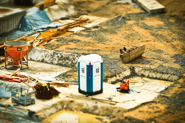 Portable toilet on an active construction site.
